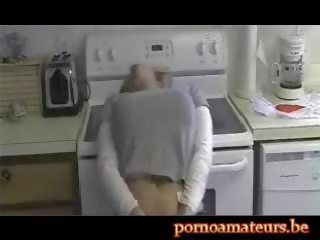 Delight masturbatingin the kitchen
